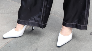 Detail of the white Jude Fame dagger-heel pumps worn by Chloë Grace Moretz.